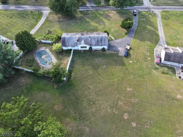 an aerial view of a house with outdoor space