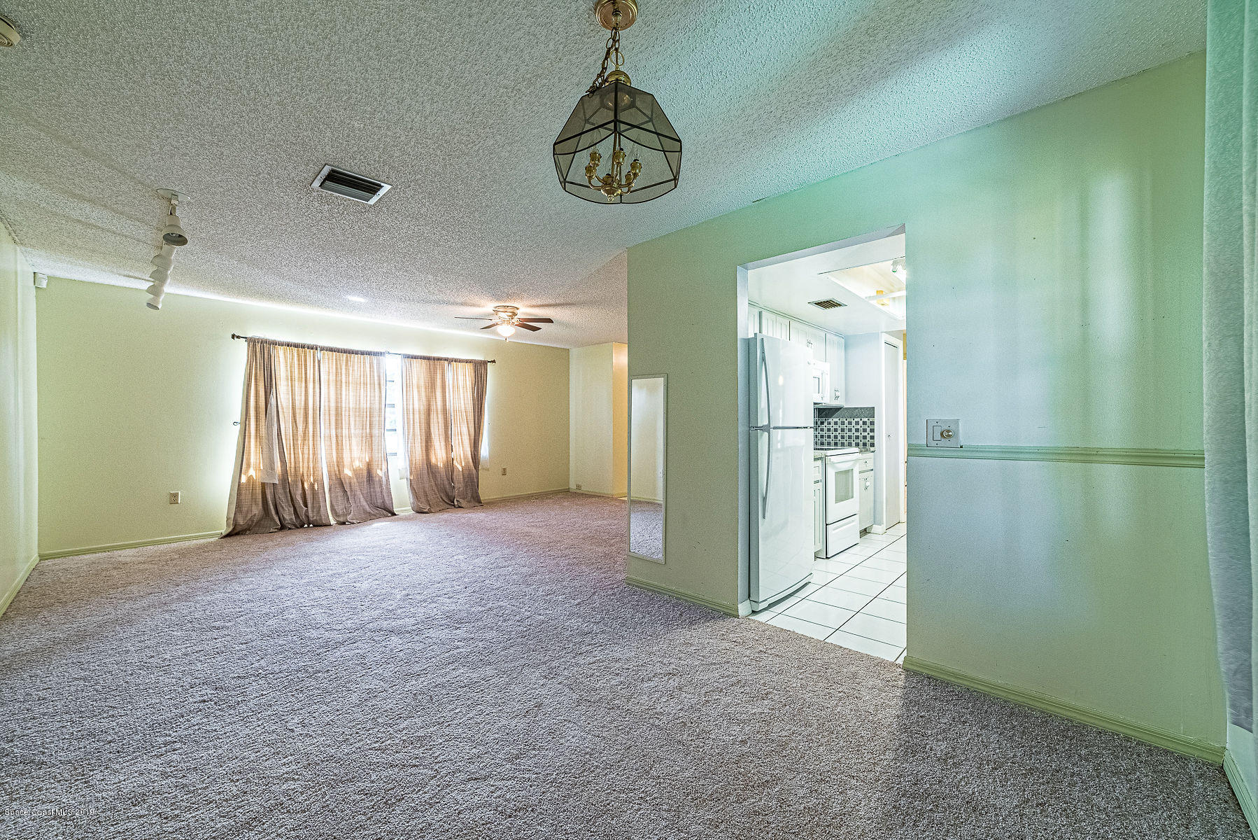 449 Lisa Road Northeast Palm Bay, FL 32907 - Photo 14 of 29 Living Room/Dining Room views