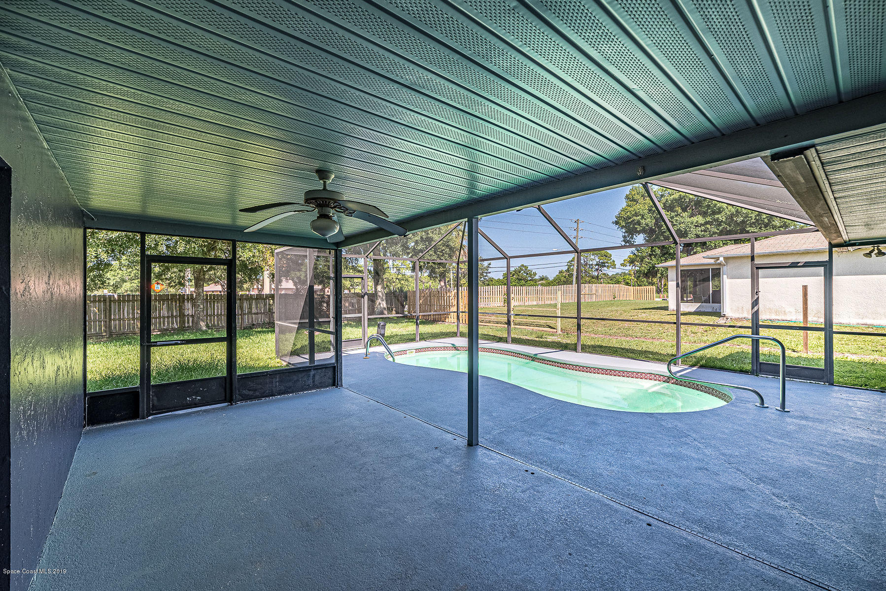 449 Lisa Road Northeast Palm Bay, FL 32907 - Photo 4 of 29 Screened in Porch