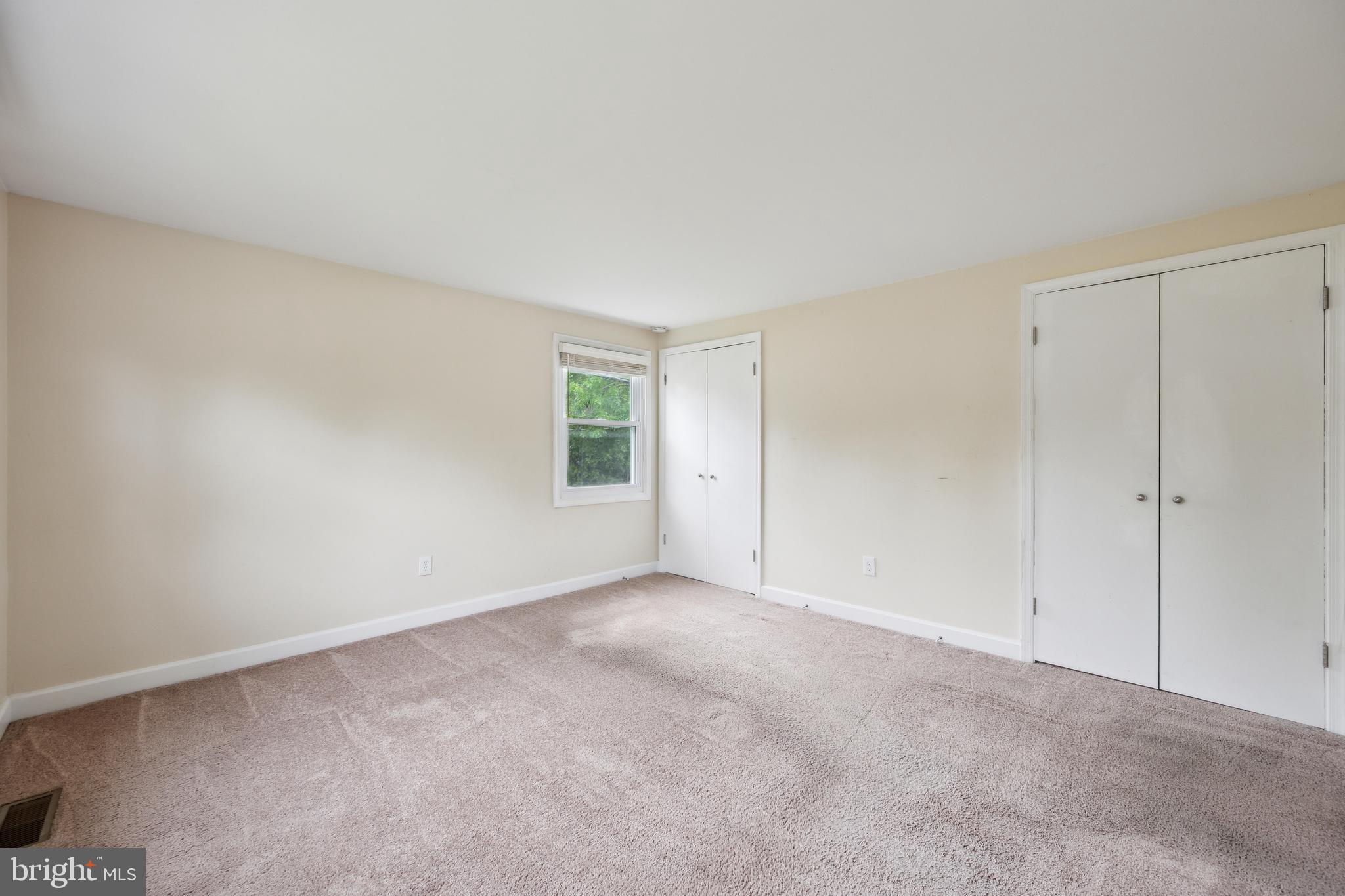 12430 Shadow Lane Bowie, MD 20715 - Photo 20 of 24 a view of an empty room with a window