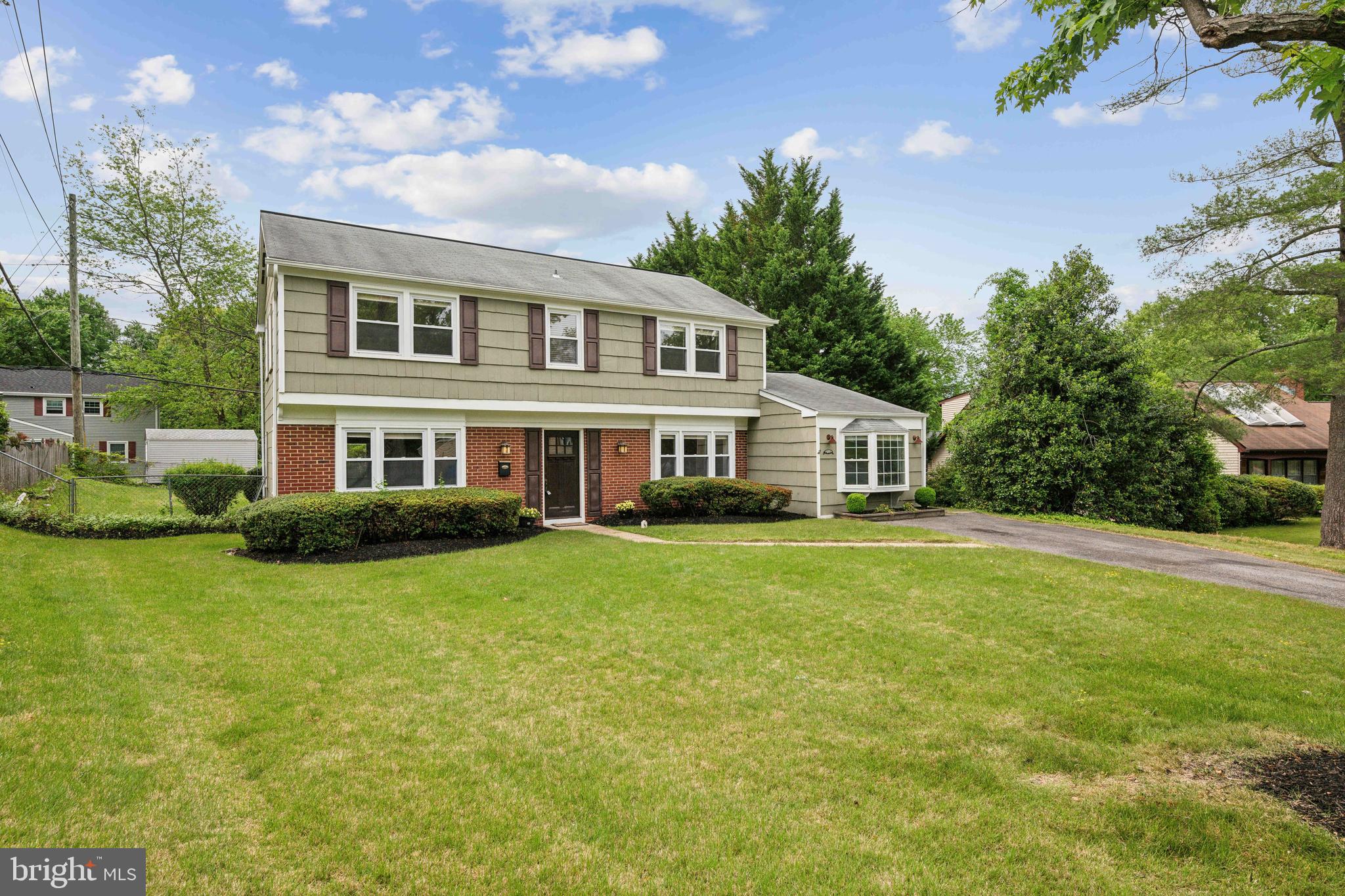 12430 Shadow Lane Bowie, MD 20715 - Photo 21 of 24 a front view of a house with a garden