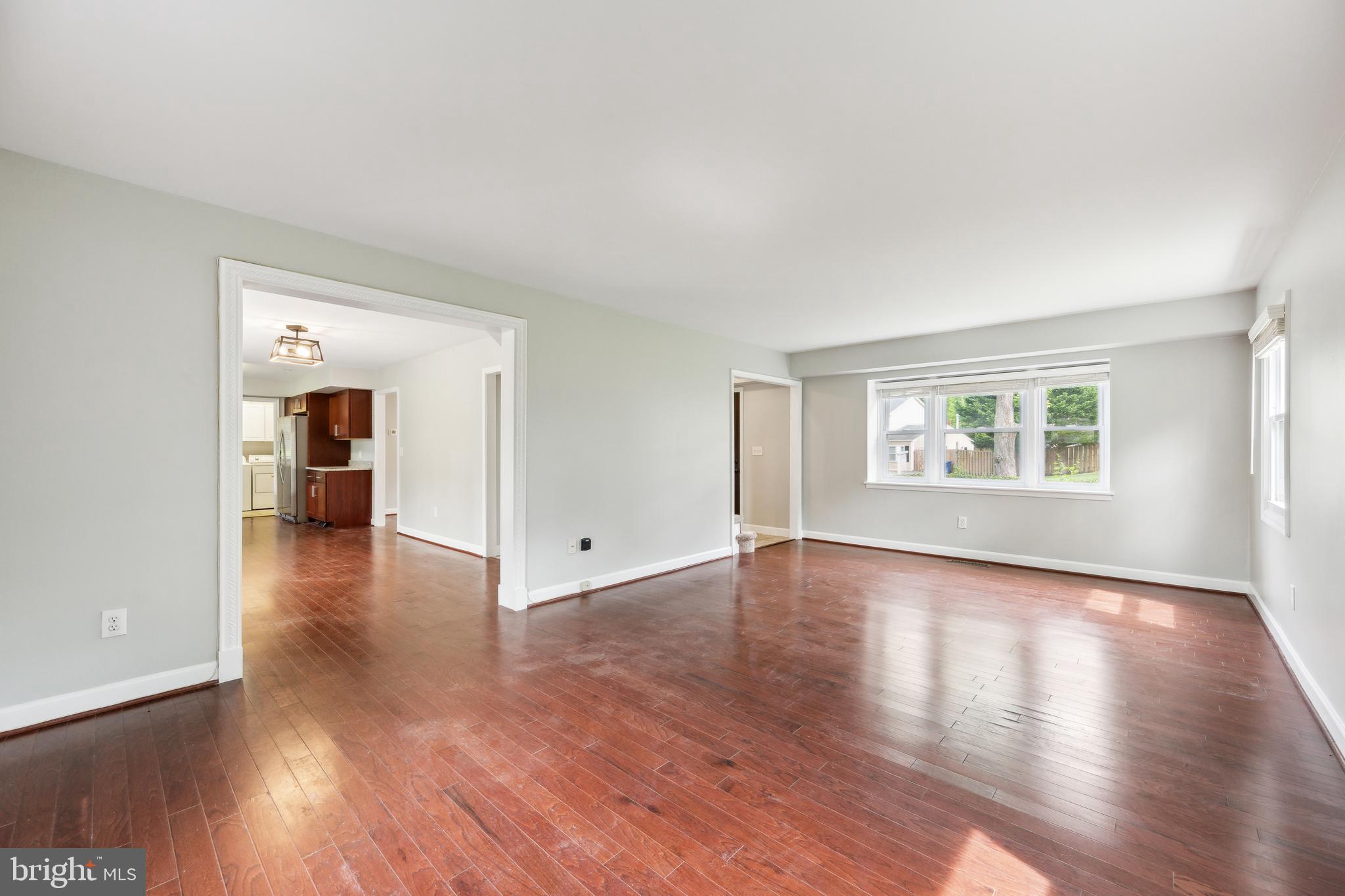 12430 Shadow Lane Bowie, MD 20715 - Photo 3 of 24 an empty room with wooden floor and windows
