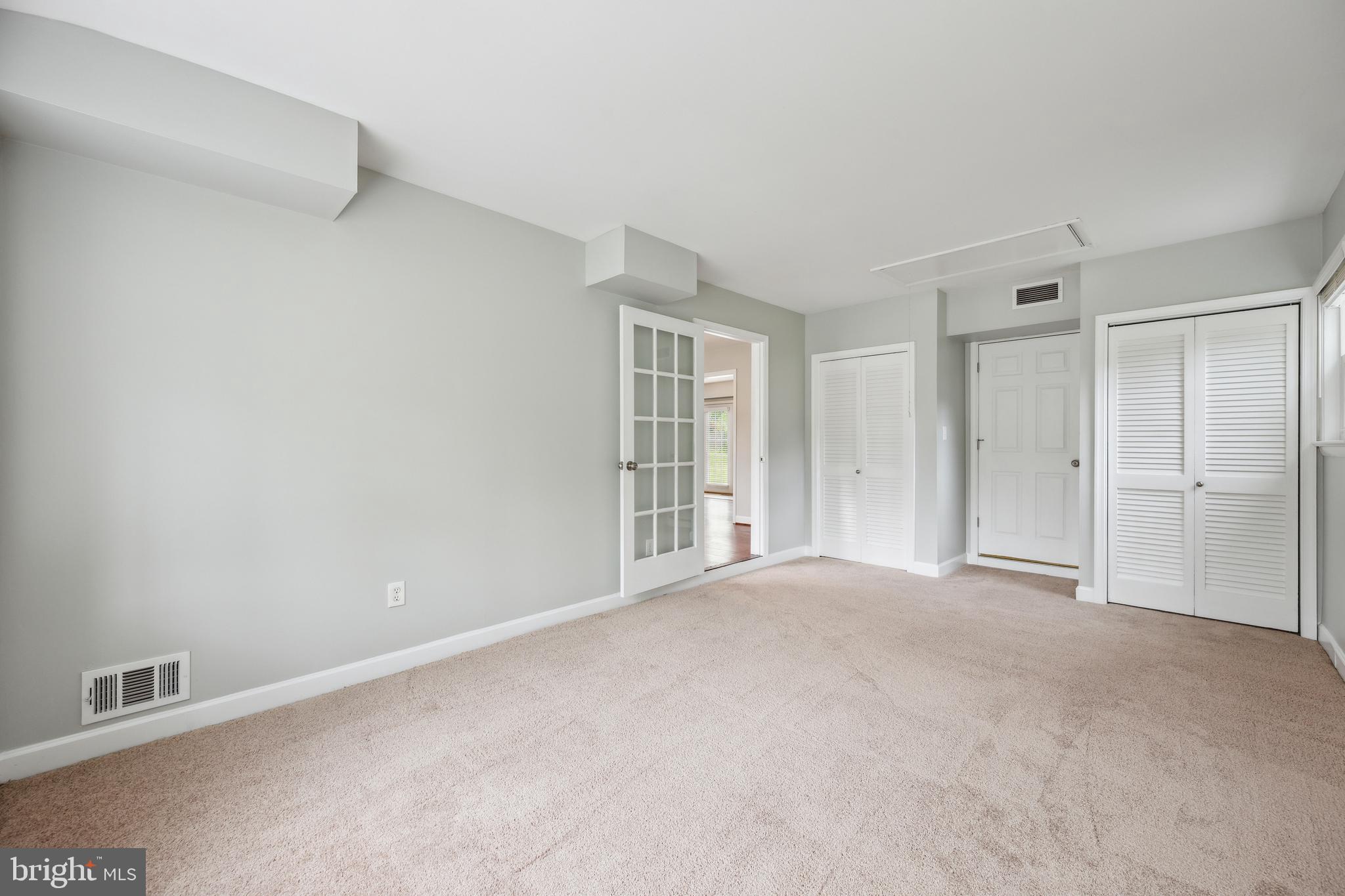 12430 Shadow Lane Bowie, MD 20715 - Photo 8 of 24 a view of an empty room with closet and a window