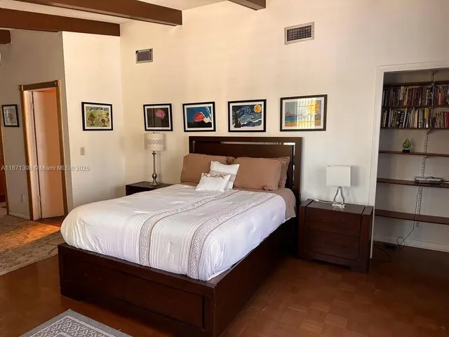 a bedroom with a bed and closet