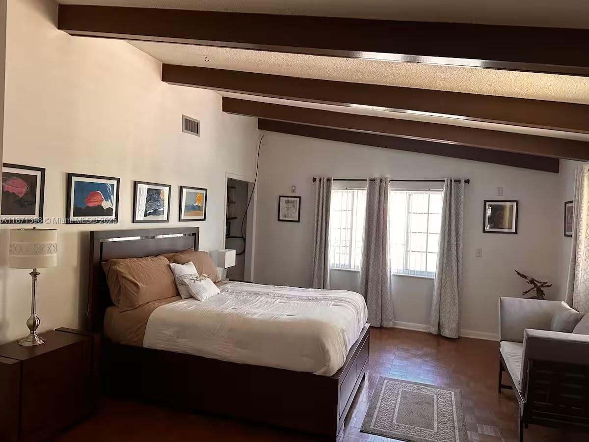 22488 Southwest Nautilus Boulevard, Unit 2 Dunnellon, FL 34431 - Photo 5 of 7 a bedroom with a bed and wooden floor