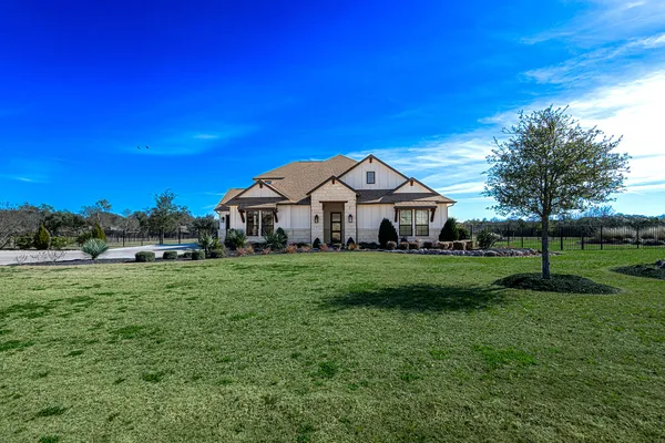 a view of a house with a big yard