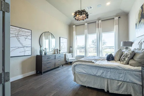 a bedroom with bed and window