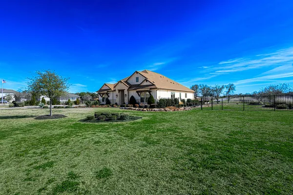 a view of a house with a big yard