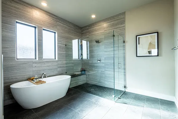 a bathroom with double vanity sinks a vanity and a mirror