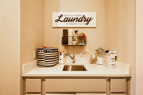 a view of a workspace with furniture and a potted plant