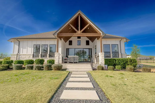 a view of a patio with chairs and a table