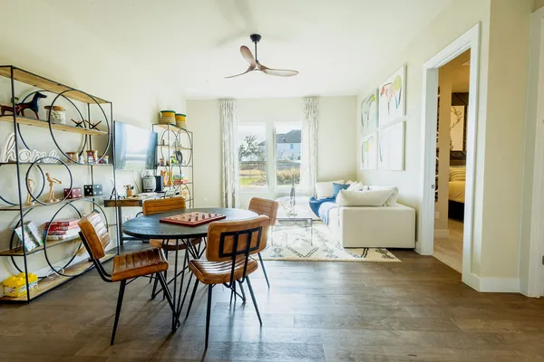 a dining room with furniture and window