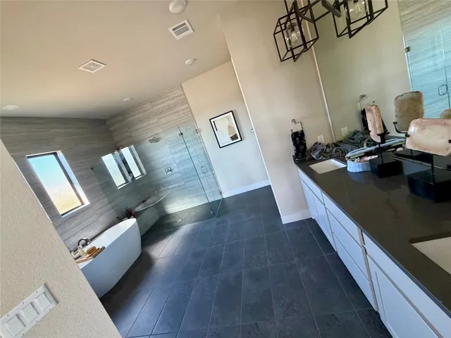 a kitchen with sink refrigerator and stove