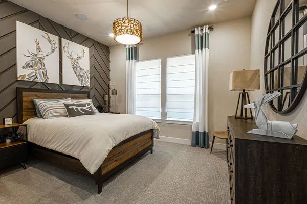 a bedroom with a bed and a table in it