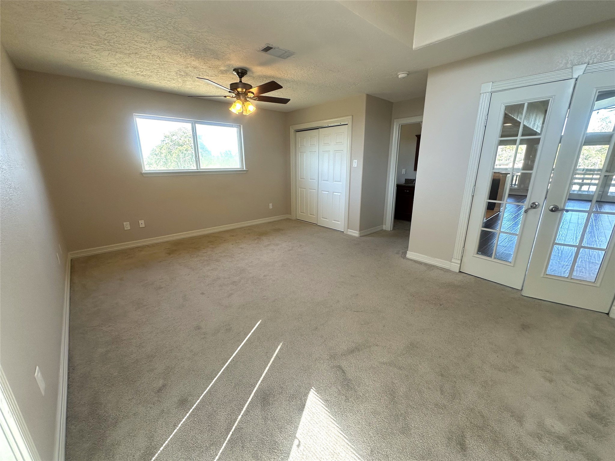 20527 Rio Villa Drive Houston, TX 77049 - Photo 14 of 18 a view of an empty room with chandelier and a window