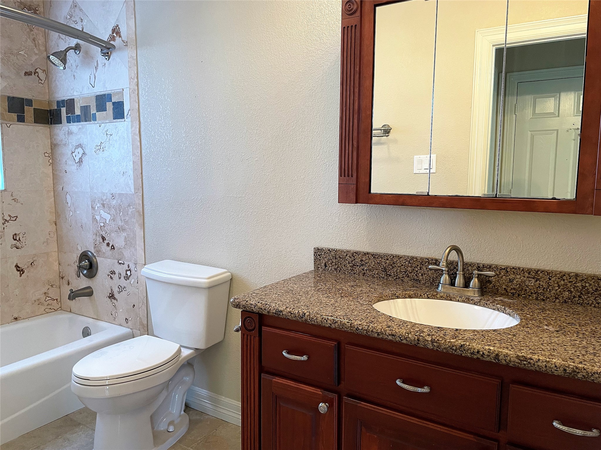 20527 Rio Villa Drive Houston, TX 77049 - Photo 15 of 18 a bathroom with a granite countertop sink toilet and shower