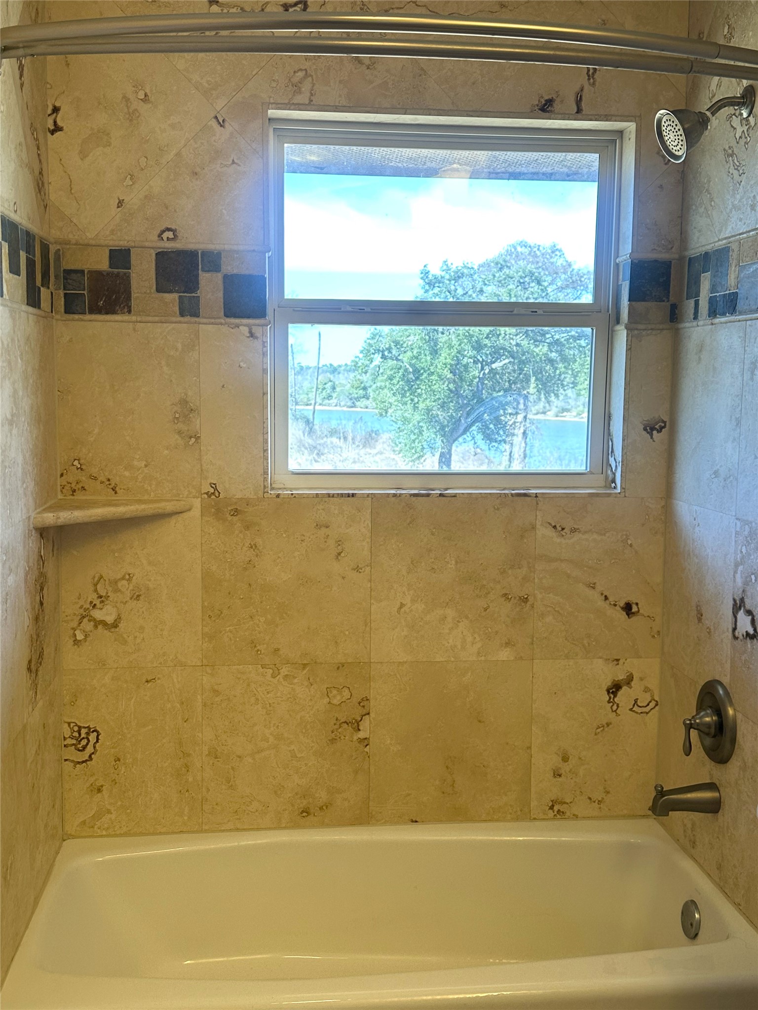 20527 Rio Villa Drive Houston, TX 77049 - Photo 18 of 18 a bathroom with a bathtub and window