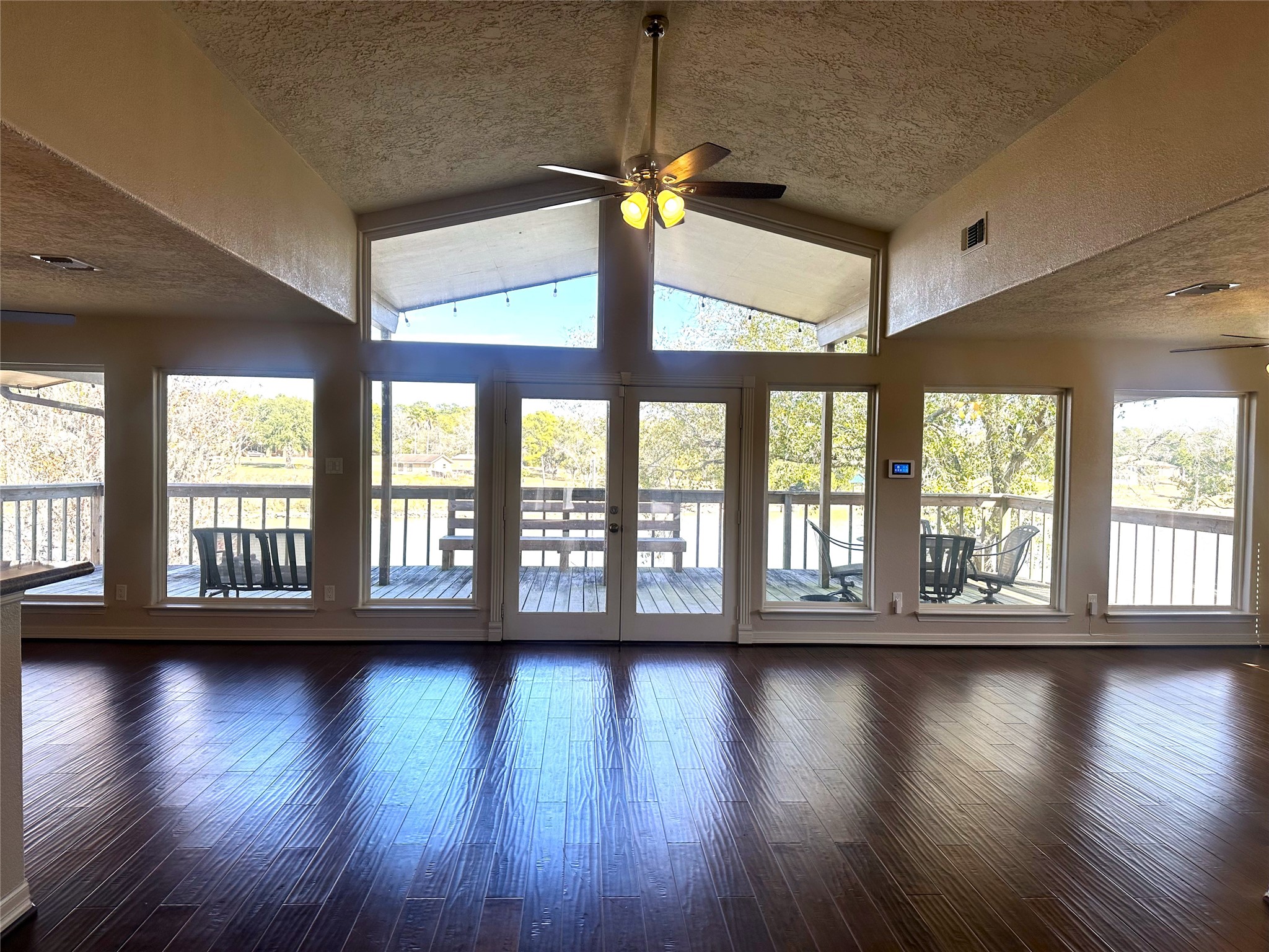 20527 Rio Villa Drive Houston, TX 77049 - Photo 7 of 18 a view of an empty room with wooden floor and a window