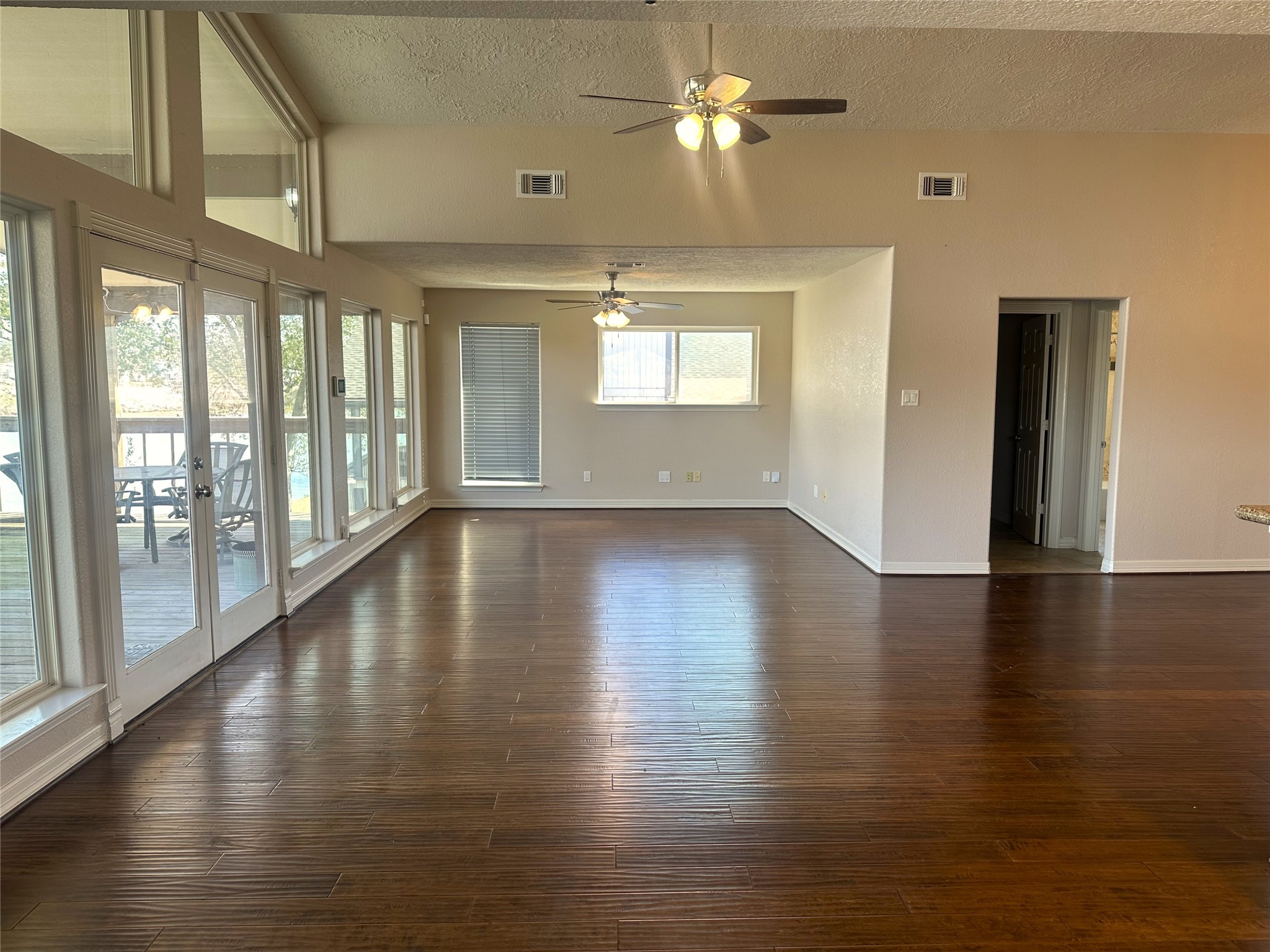 20527 Rio Villa Drive Houston, TX 77049 - Photo 10 of 18 a view of an empty room with wooden floor and a window