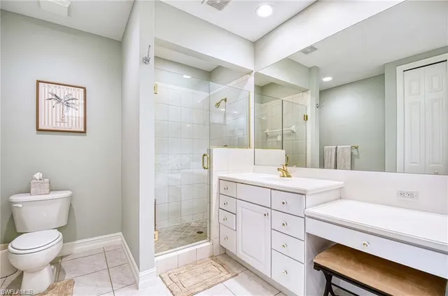 a bathroom with a toilet sink and a mirror