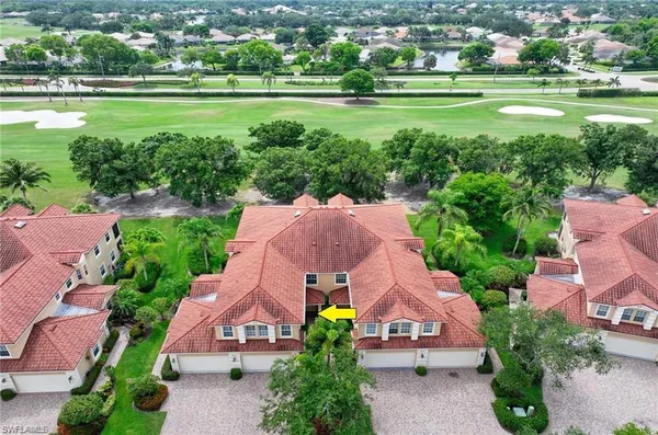 an aerial view of a houses with outdoor space and a lake view