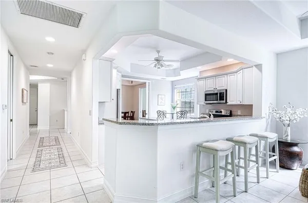 a kitchen with stainless steel appliances a sink and a refrigerator