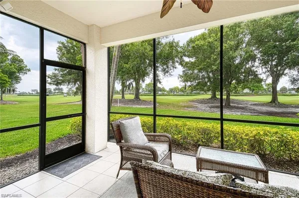a view of a porch with furniture and garden