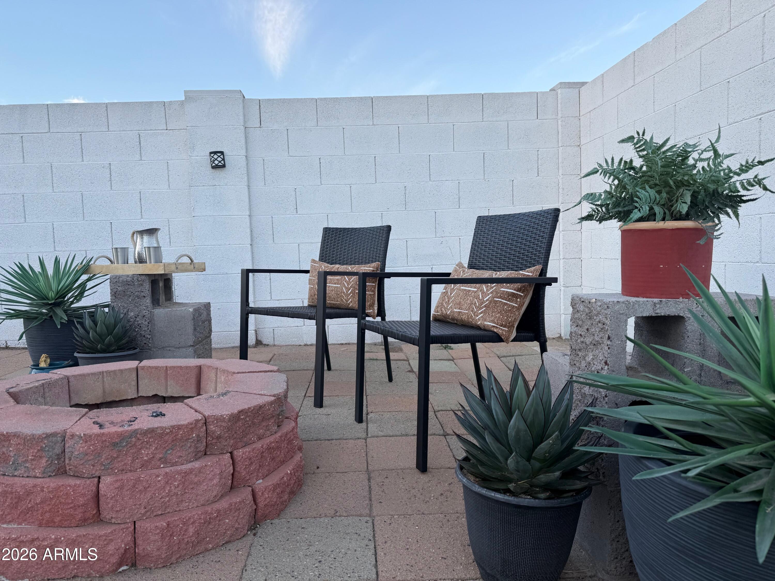 17827 North 9th Avenue Phoenix, AZ 85023 - Photo 22 of 29 a living room with furniture potted plant and a lamp