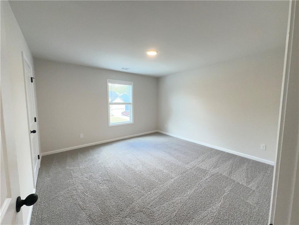 345 Rodeo Drive Auburn, GA 30011 - Photo 18 of 22 an empty room with windows