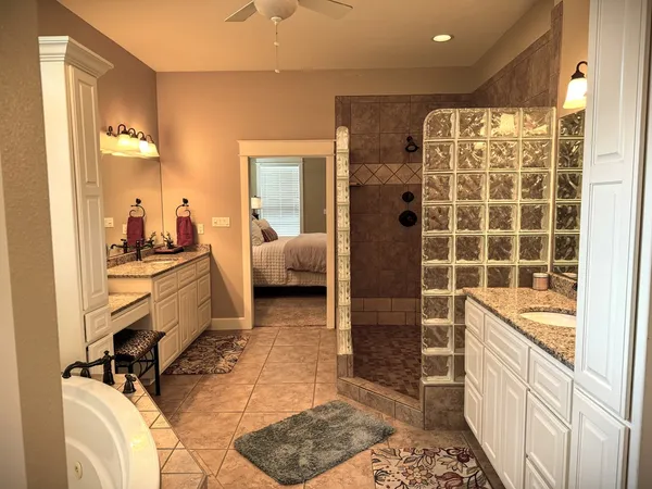 a room with a bed and a view of bathroom