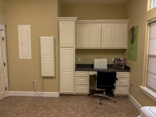 a view of kitchen with workspace and a window