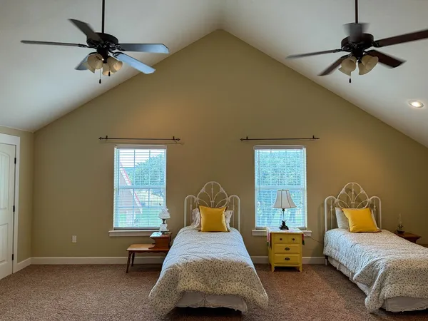 a bed room with a bed and a chandelier