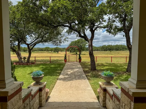 a view of two chairs in the balcony