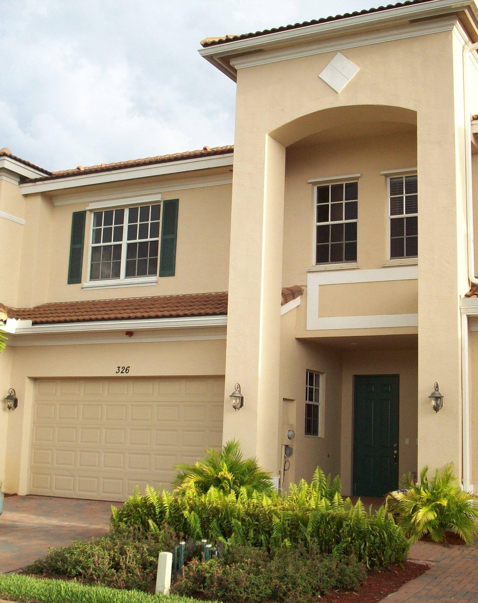 326 Southwest Walking Path Stuart, FL 34997 - Photo 1 of 49 front view of a house