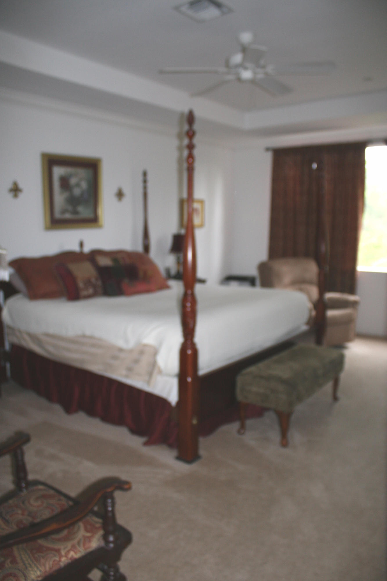 326 Southwest Walking Path Stuart, FL 34997 - Photo 22 of 49 a bedroom with a bed and window