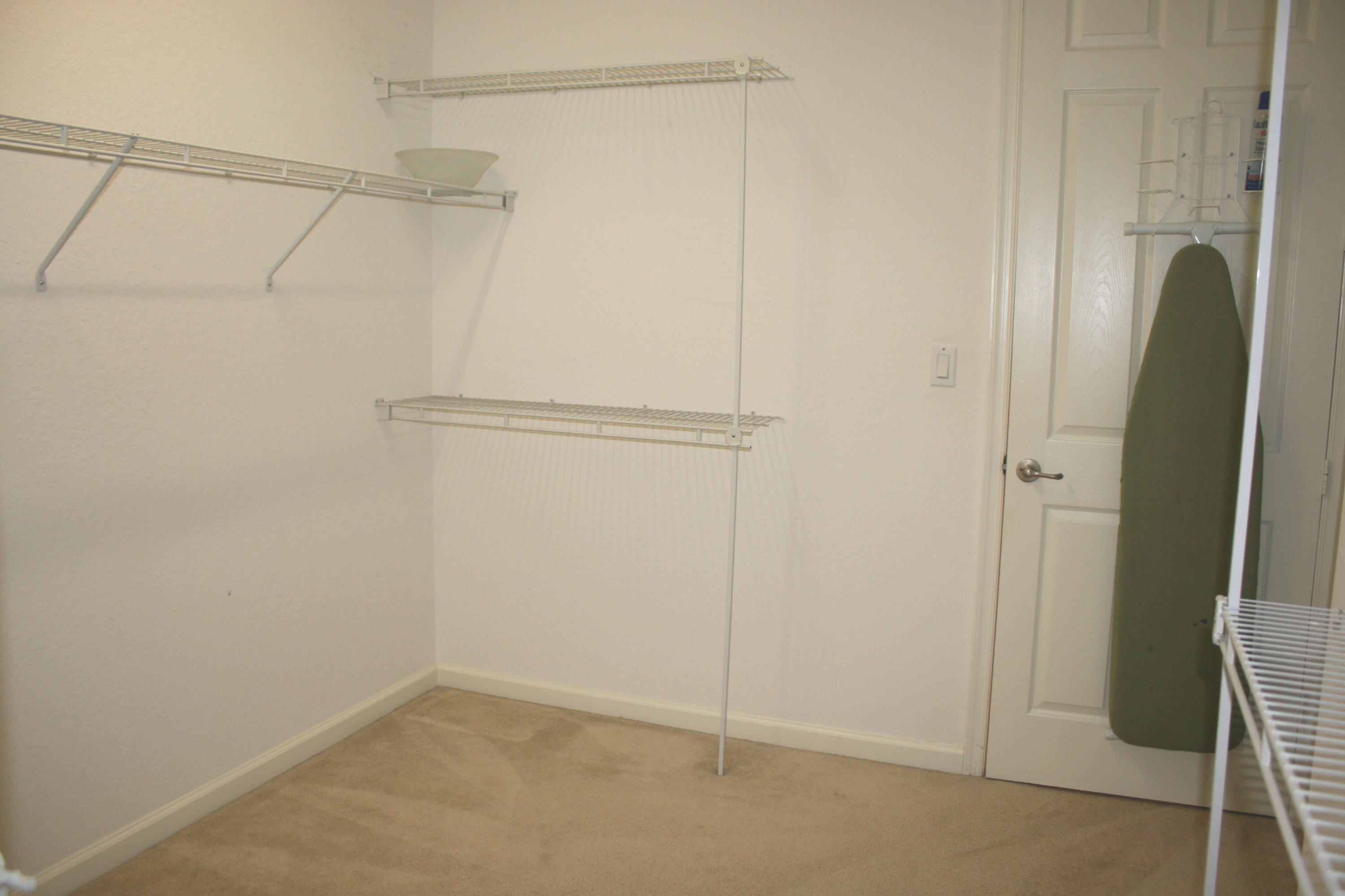 326 Southwest Walking Path Stuart, FL 34997 - Photo 29 of 49 a view of a room with racks on the wall