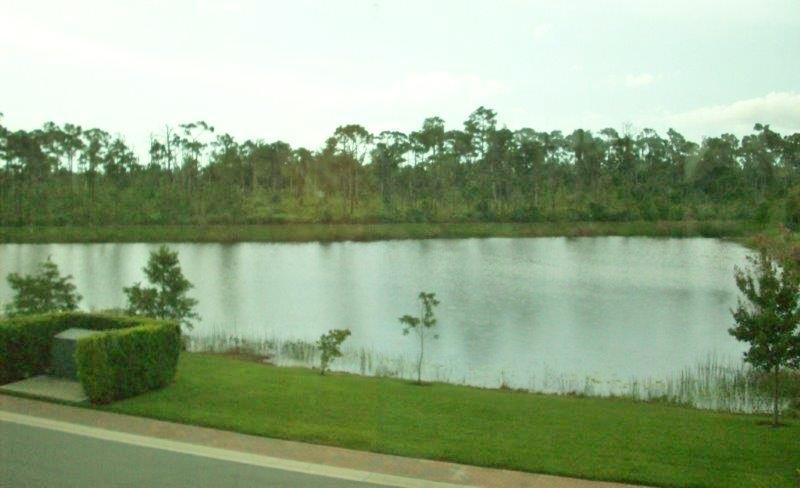 326 Southwest Walking Path Stuart, FL 34997 - Photo 38 of 49 a view of a lake with houses in the back