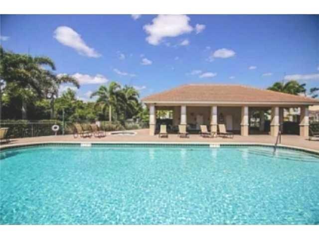 326 Southwest Walking Path Stuart, FL 34997 - Photo 41 of 49 a view of a house with a yard porch and sitting area