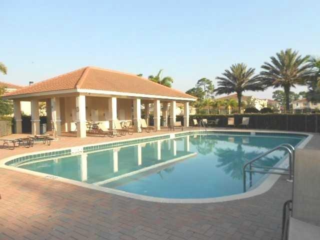 326 Southwest Walking Path Stuart, FL 34997 - Photo 42 of 49 a view of a house with a swimming pool