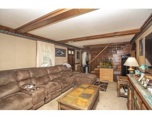 121 Chipaway Road Freetown, MA 02717 - Photo 23 of 37 a living room with furniture and a flat screen tv