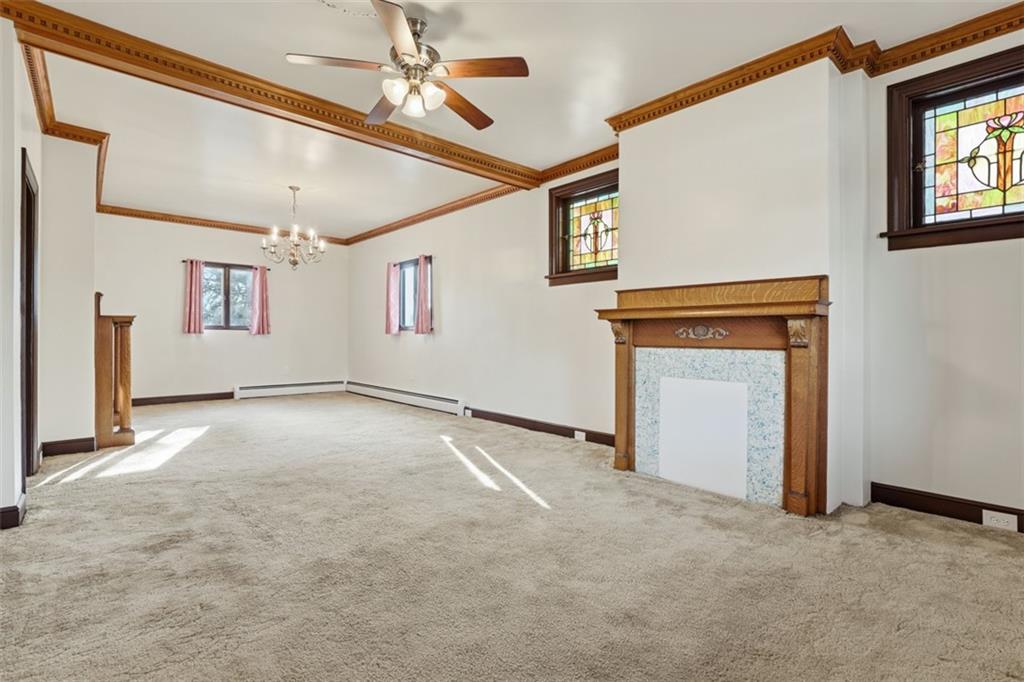 218 10th Street Aspinwall, PA 15215 - Photo 11 of 49 a view of empty room with windows and ceiling fan