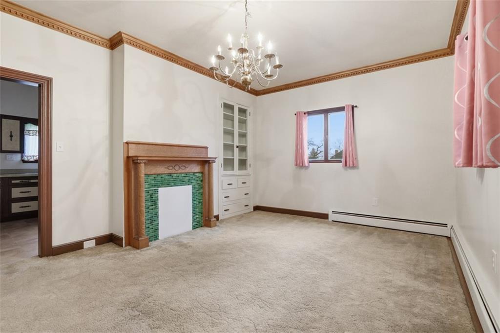 218 10th Street Aspinwall, PA 15215 - Photo 16 of 49 an empty room with windows and fireplace