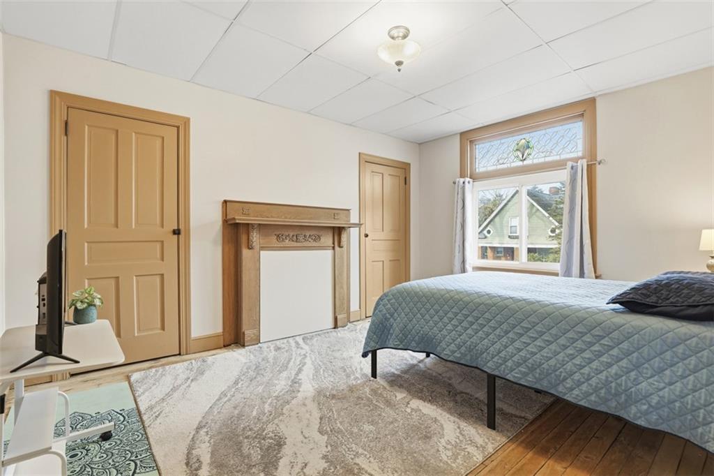 218 10th Street Aspinwall, PA 15215 - Photo 24 of 49 a bedroom with a bed and a window
