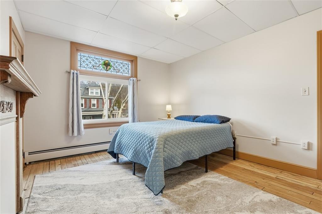218 10th Street Aspinwall, PA 15215 - Photo 25 of 49 a bedroom with a bed and window