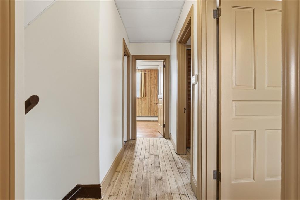 218 10th Street Aspinwall, PA 15215 - Photo 28 of 49 a view of a hallway with wooden floor and entryway