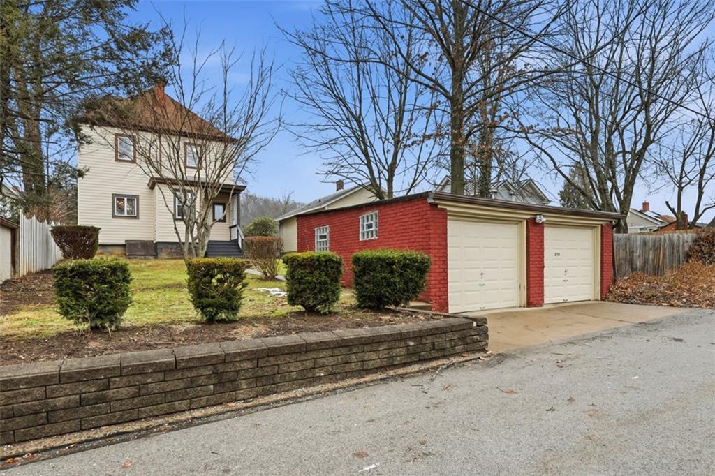 218 10th Street Aspinwall, PA 15215 - Photo 39 of 49 a front view of a house with a yard and garage