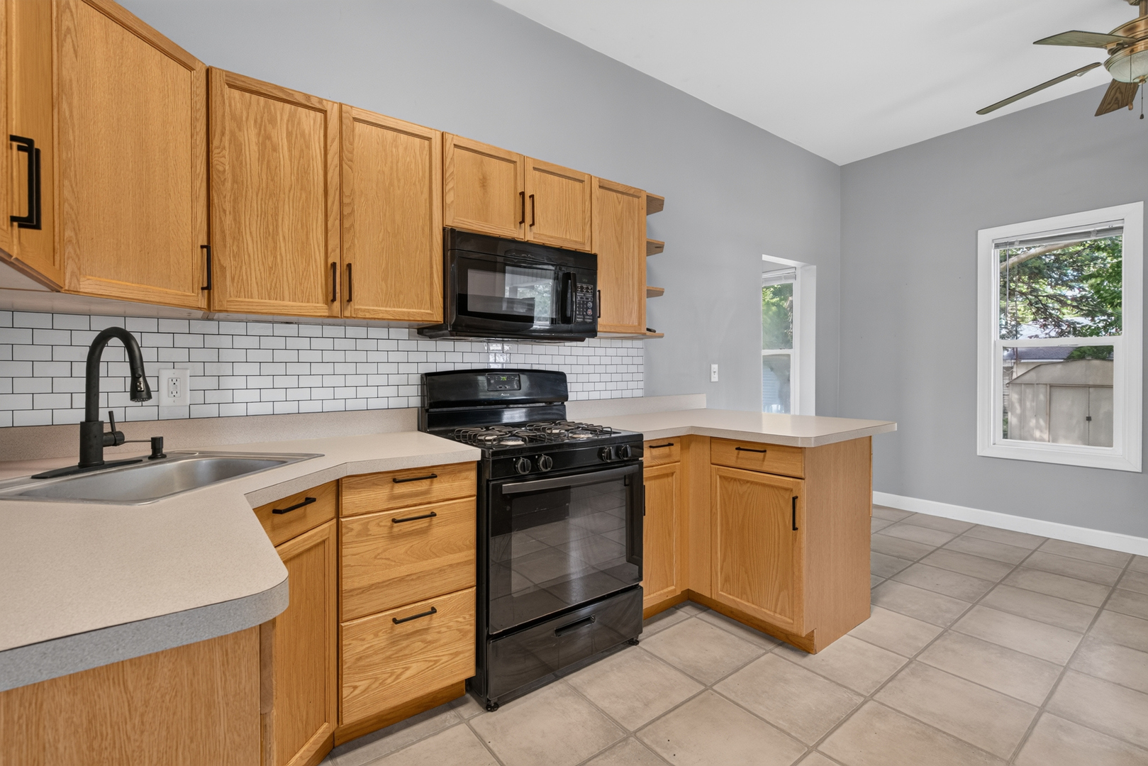 1128 Butler Street Morris, IL 60450 - Photo 12 of 28 a kitchen with stainless steel appliances granite countertop a sink dishwasher stove and refrigerator