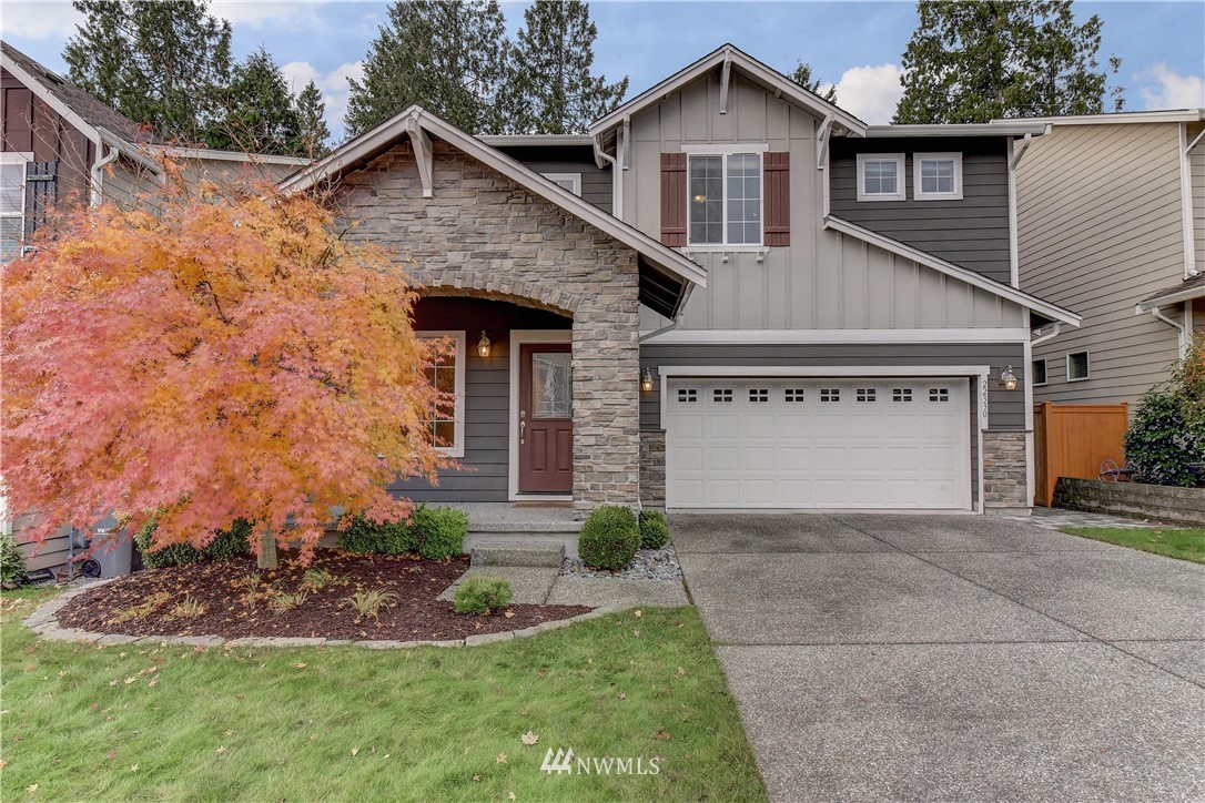 22330 35th Drive Southeast Bothell, WA 98021 - Photo 1 of 25 a front view of a house with a yard and garage