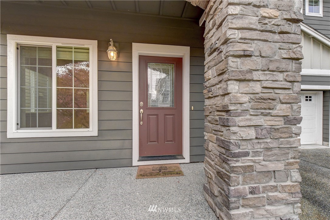 22330 35th Drive Southeast Bothell, WA 98021 - Photo 2 of 25 a front view of a house with a door