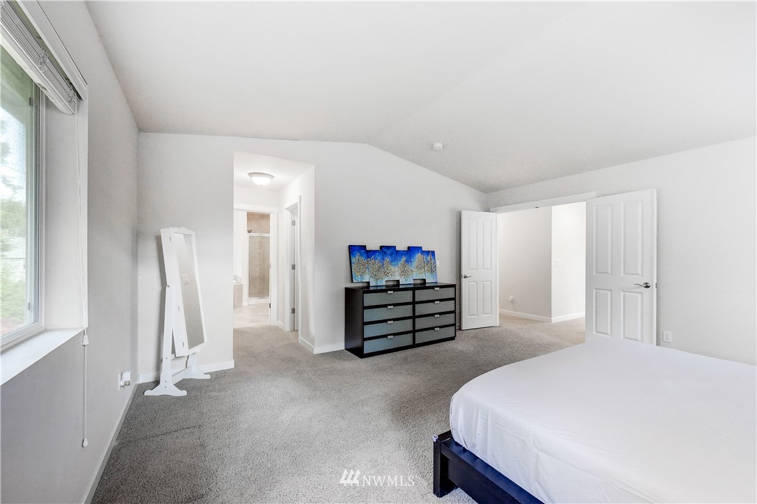 22330 35th Drive Southeast Bothell, WA 98021 - Photo 13 of 25 a bedroom with a bed and a flat screen tv